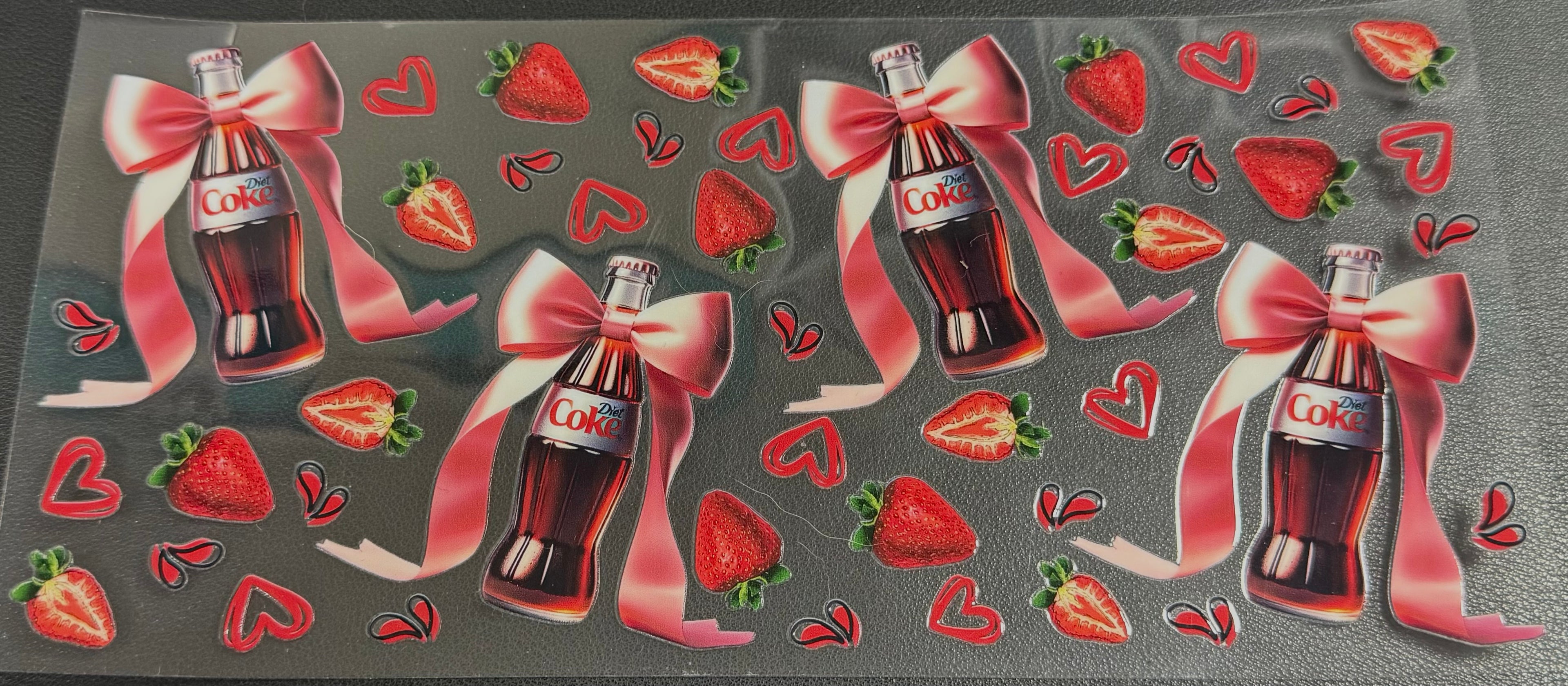 Coke bottles with bows and strawberries
